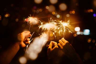 Celebrating with sparklers in the night