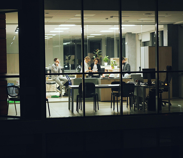 Business professionals working at night 247 it support services for SMBs